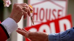 An elderly hand drops keys into an open hand. Stock Footage