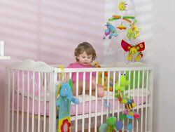 HD CRANE: Adorable Baby Exploring The Crib Stock Footage