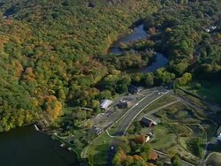 MS AERIAL ZI ZO PAN Shot of Eli Whitney Museum and covered bridge / Connecticut, United States Stock Footage