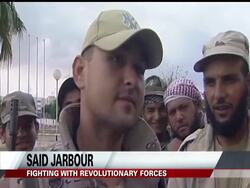 A Libyan spokesman said revolutionary forces have captured some fighters close to one of Moammar Gadhafi's sons in the fugitive leader's hometown but that he has no information that the son himself has been seized. Instructional Video