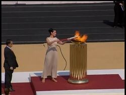 Security was tight as hundreds of Athenians stood in line for hours to watch Sunday's handover ceremony of the Olympic flame to organisers of the Beijing Games. News Clip