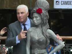 Mitch Winehouse & Janis Winehouse  at Amy Winehouse statue unveiling on 14th September 2014 in London, England. Stock Footage