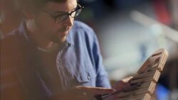 Expert craftsman chisels wooden chair frame in workshop Stock Footage