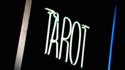 A neon sign reads, 'Tarot.' Stock Footage
