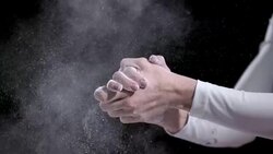 SLO MO Female gymnast clapping hands to remove chalk Stock Footage