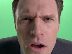 ECU, Businessman making face into camera in studio Stock Footage