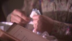 A 19th century mistress does needlework while her companion reads a book. Stock Footage