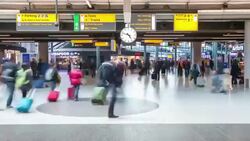 HD time-lapse panning: Traveler at Airport Arrival Terminal Schiphol Amsterdam Netherlands Stock Footage