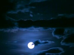 Full Moon rising over cloud Stock Footage