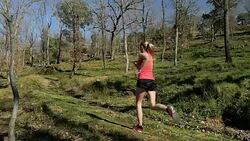 Running in forest with long jumps Stock Footage