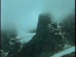 WA pan over snowy mountain under thick layer of fog, Uganda, Africa Stock Footage