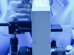 scientist using microscope Stock Footage