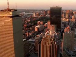 LOW AERIAL, Boston downtown buildings at sunset, Massachusetts, USA Stock Footage