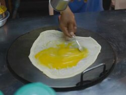 The making Of Thai Roti with egg Stock Footage