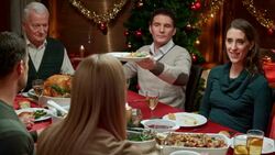 Young woman serving mashed potatoes to other family members Stock Footage