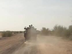 Soldiers riding a truck on the desert. Stock Footage