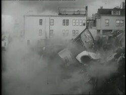 A house falls off a hill and collapses in San Francisco, California. News Clip