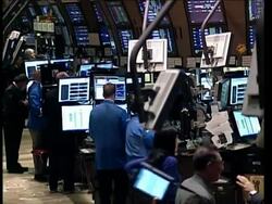 Investors were encouraged by the Fed's latest improved assessment of the economy, but not enough to propel the Dow Jones industrial average past 10,000. News Clip