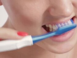 Cheerful young woman brushing teeth. Stock Footage