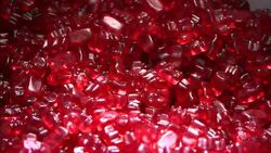 A scoop removes a portion of cinnamon gummie bears. Stock Footage