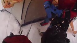 Mountain climbers secure their gear as snow and wind whip past their tent and campsite. Stock Footage