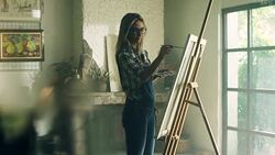 Young female painter at the artist's studio Stock Footage