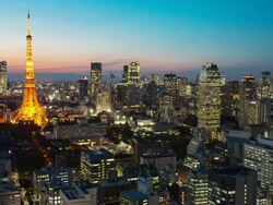 WS T/L View of sunset over Tokyo tower with kamiyacho and roppongi one chome business districts / Tokyo, Japan Stock Footage