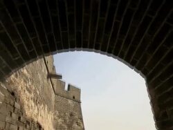 Going through a tunnel and coming out to a flat spacious area of the Great Wall of China.  Stock Footage