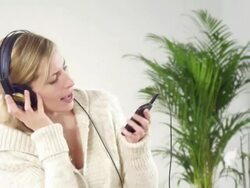 Woman listening music Stock Footage
