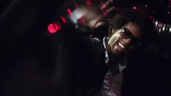 Hip-hop star in limousine gives peace signs to fans and paparazzi at awards show Stock Footage