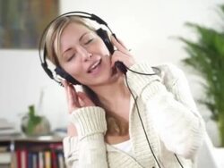 Woman listening music Stock Footage