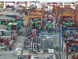 Aerial View: Busy working crane loading containers Stock Footage