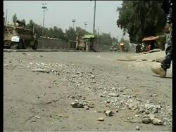 Two roadside bombs explode next to patrol by Iraqi police and Sunni fighters News Clip