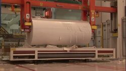 A machine processes a large roll of paper. Stock Footage