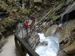 MS Woman walking along wild river through gorge Wimbach-Klamm / Berchtesgaden, Bavaria, Germany Stock Footage