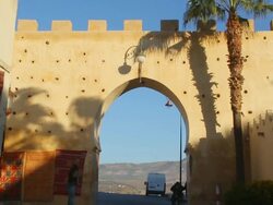 MS TD Shot of reveal key hole shaped door in wall / Fes, Centro-North, Morocco Stock Footage