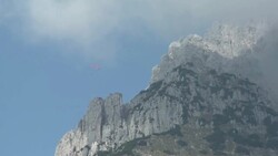 Paraglider flying over the Wilder Kaiser Valley Stock Footage
