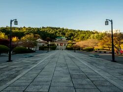 WS T/L View of people roaming in Chungnyeolsa temple (keep an ancestral tablet in honor of the dead of Japanese Invasion of Korea in 1592 in a shrine) / Busan, Gyeongsangnam do, South Korea  Stock Footage