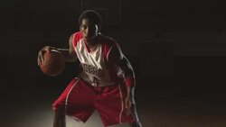 A basketball player shows off his skills while dribbling the ball. Stock Footage