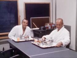 Astronauts Alan Shepard and John Glenn eating breakfast before Project Mercury 3 mission Stock Footage