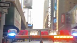 NYPD Police Car on Times Square in New York City With Emergency Lights Beam Car On Stock Footage