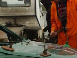 MS SLO MO PAN ZI Man fixing banger car / Manchester, United Kingdom   Stock Footage