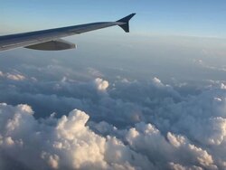 View out of plane window over clouds, some turbulence Stock Footage