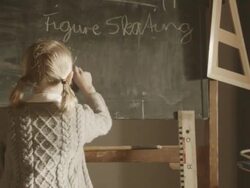MS ZI Shot of girl writing something on blackboard / Grossweil, Bavaria, Germany  Stock Footage