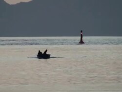 Boat of fishermen emptying nets in the sea Stock Footage