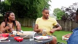 MS laughing friends having dinner at outdoor table on summer evening Stock Footage