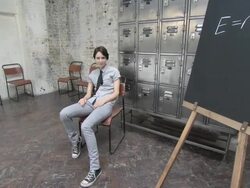 Young woman sitting in classroom and throwing paper airplane then paper airplanes are thrown at her Stock Footage
