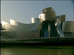 MS pan right along Guggenheim museum, Bilbao, Spain Stock Footage