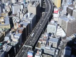 High elevation view of Tokyo city showing modes of transport using  Lensbaby, Japan, Asia, Time Lapse Stock Footage