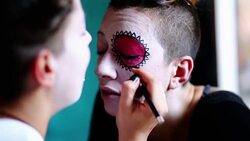 Young Woman Is Getting Sugar Skull Mask Drawn Stock Footage